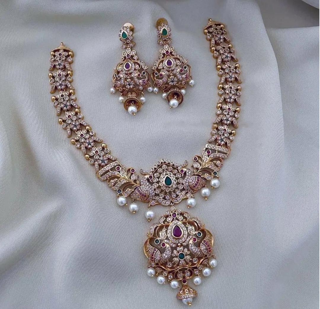 S-18: Traditional Peacock Motif Necklace Set with Jhumka | CZ & AD Gold Plated