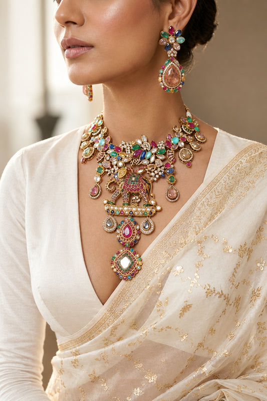 Pastel fusion gold-plated jewelry set with semi-precious stones, elephant motif necklace and matching earrings