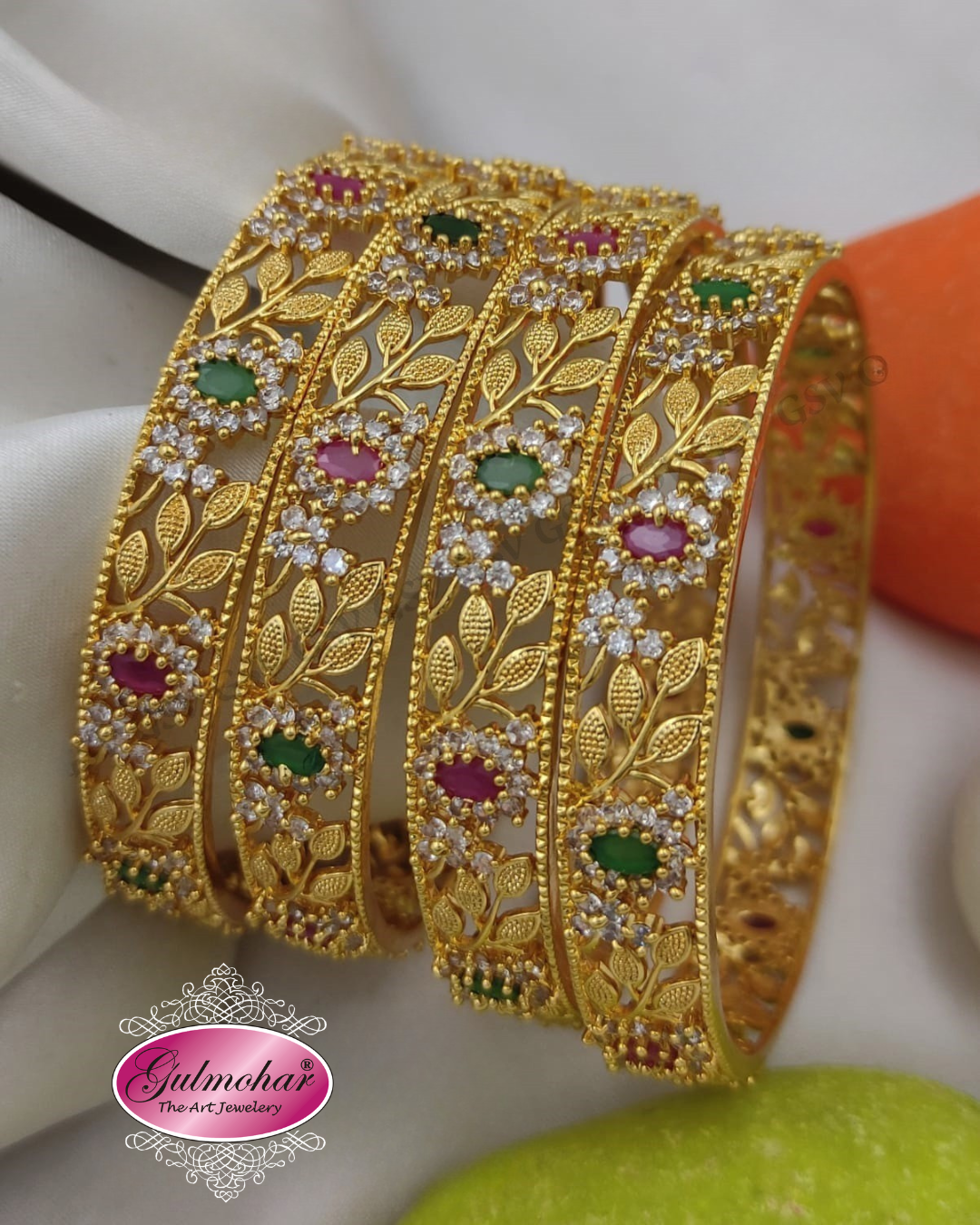 Ruby emerald floral bangles, ruby bangles, emerald bangles, floral bangles, CZ bangles, AD bangles, CZ AD bangles, South Indian bangles, South Indian jewellery, traditional South Indian bangles, gold plated bangles, 4 piece bangle set, floral design bangles, traditional bangles, bridal bangles, wedding bangles, party wear bangles, festive bangles, designer bangles, Indian bangles, Pakistani jewellery, South Indian bridal jewellery, ruby emerald jewellery